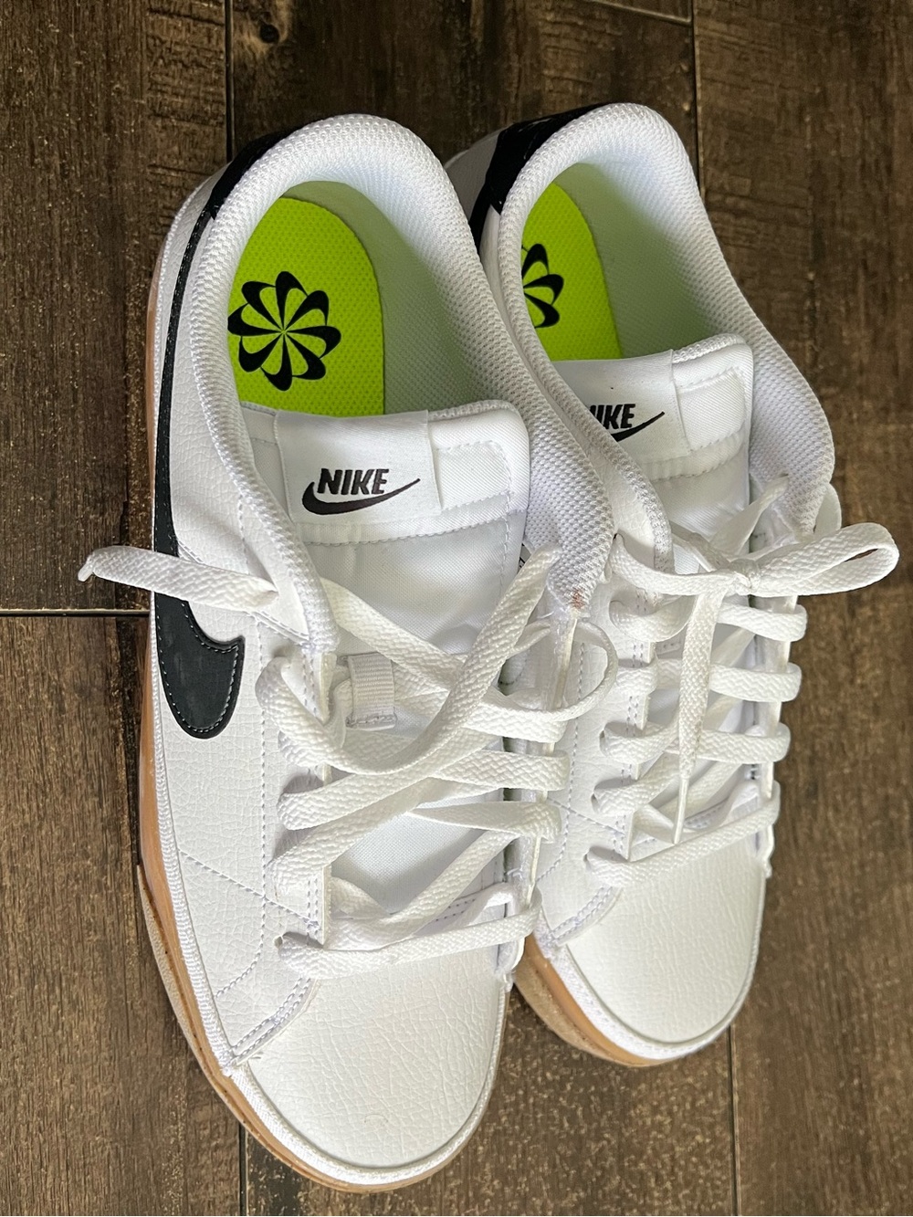 Nike White Low-Top Sneakers with Black Swoosh and Neon Green Insoles